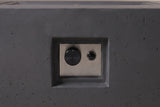 Close view of the Gela fire pit's control niche: a recessed niche in the concrete front face with a brushed steel plate, one control knob and one push button