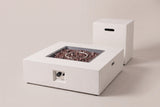 The Gela square fire pit and its tank holder in white concrete, three-quarter view on a light studio backdrop, the control niche on the front face