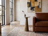 Genazzano White Marble Tapered Pedestal Side Table with a stoneware vase beside a cognac leather armchair in a sunlit loft