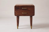 The Ghilarza nightstand in chestnut mango, front view on a light studio backdrop