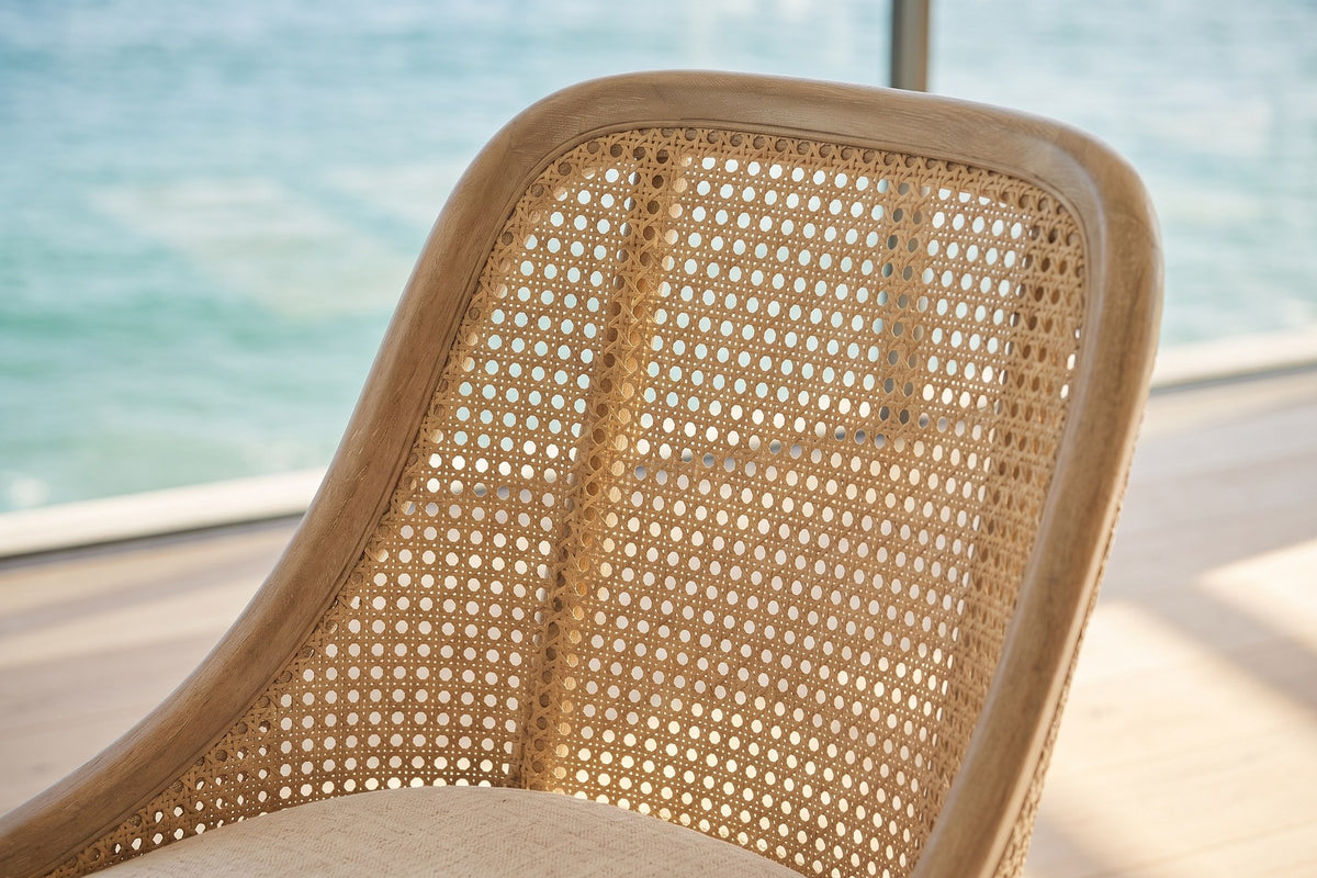 Close-up of the Gioiosa Cane-Back Upholstered Wood Dining Chair (Set of 2): cane