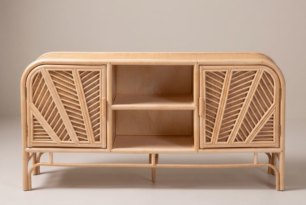 The Giovinazzo sideboard in natural rattan and cane, front view on a light studio backdrop