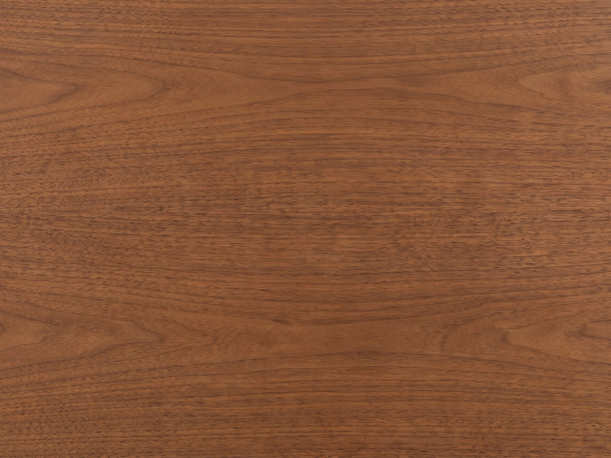 Close-up of the Gorizia 62-Inch Warm Walnut 6-Drawer Dresser: the warm walnut veneer of the top