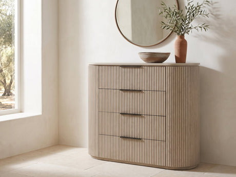 Gradisca 50-Inch Light Oak 4-Drawer Chest under a round bronze mirror in a villa bedroom