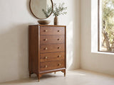 Grado 34-Inch Warm Walnut 5-Drawer Chest under a round bronze mirror in a villa bedroom