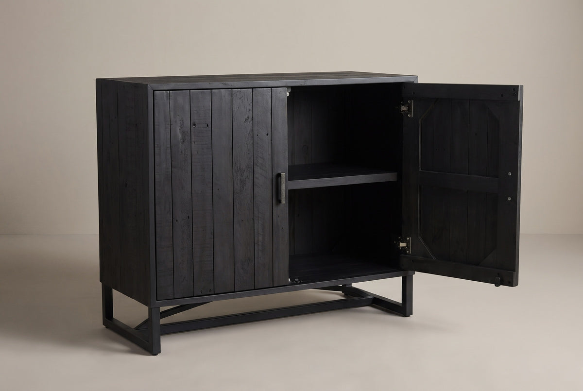 The Gravina cabinet with its right door open, showing one pine shelf inside and the plank backing on the inside of the door