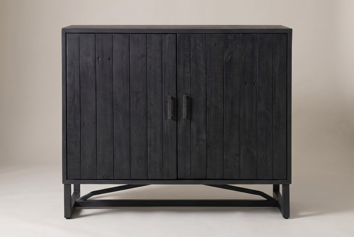The Gravina cabinet in black-stained reclaimed pine, front view on a light studio backdrop