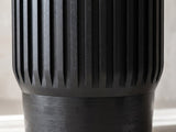 Close-up of the Grottole Black Mango Ribbed Drum Side Table: the black ribs tapering to points above the stacked mango base