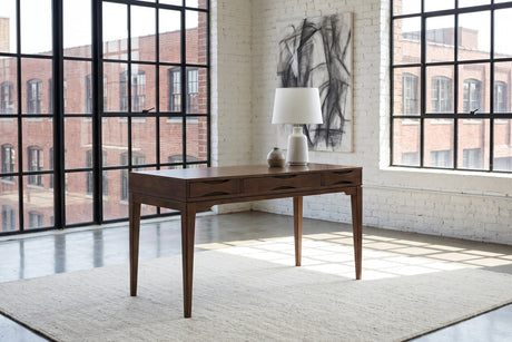 Guardavalle 60-Inch 2-Drawer Solid Wood Mid-Century Writing Desk with Keyboard Tray in a city loft