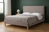 Guardiagrele bed against a deep forest green wall in a Brooklyn brownstone bedroom with a herringbone oak floor