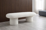 Gubbio ivory boucle bench in front of a dark walnut slat wall in a New York loft with a pale grey-washed oak floor