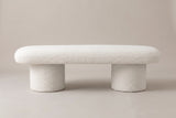 The Gubbio bench in ivory boucle, front view on a light studio backdrop