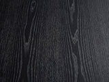 Close-up of the Imola Black Ash Oval Pedestal Coffee Table: the open-pore black ash grain of the top