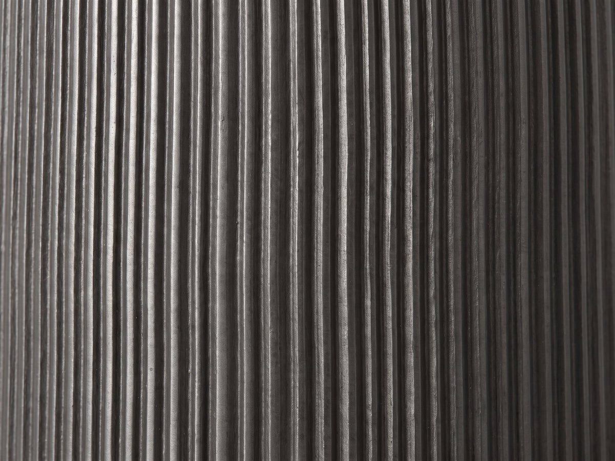 Close-up of the Irsina Cast Aluminum Tulip Pedestal Side Table: the fine vertical ribs of the black nickel pedestal