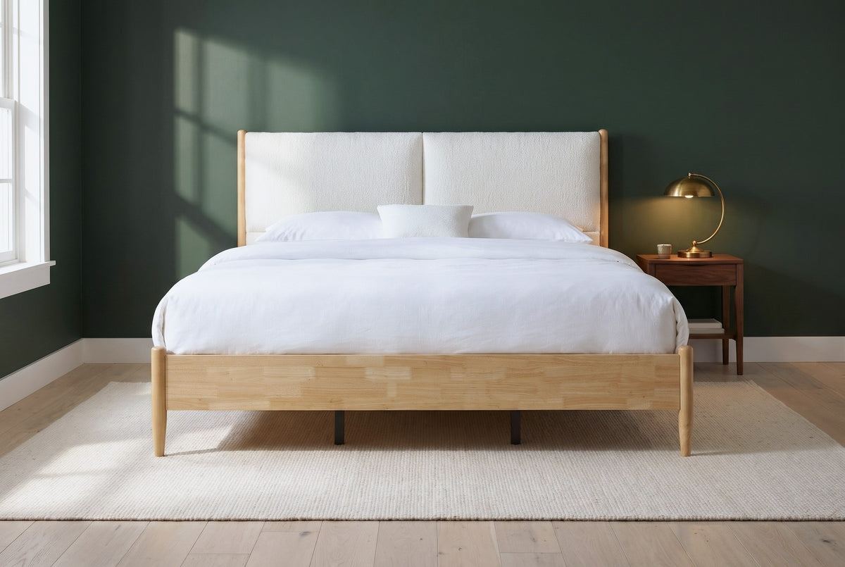 Isernia bed against a deep green wall in a Nashville farmhouse bedroom with a cream wool rug and pale oak floor