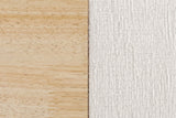 Close-up of the Isernia bed where natural rubberwood meets the cream textured upholstery