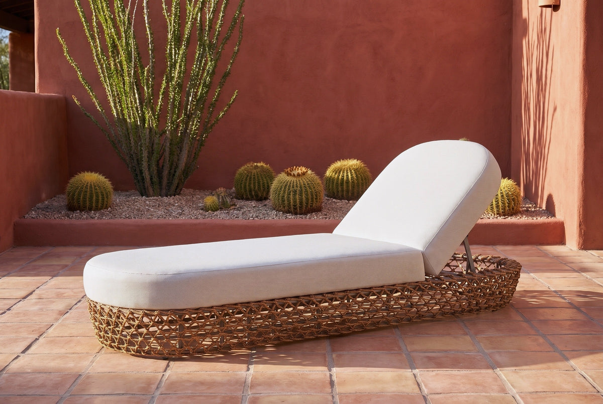 Isnello woven lounger on saltillo tiles in a Tucson courtyard with a terracotta adobe wall, an ocotillo and golden barrel cacti