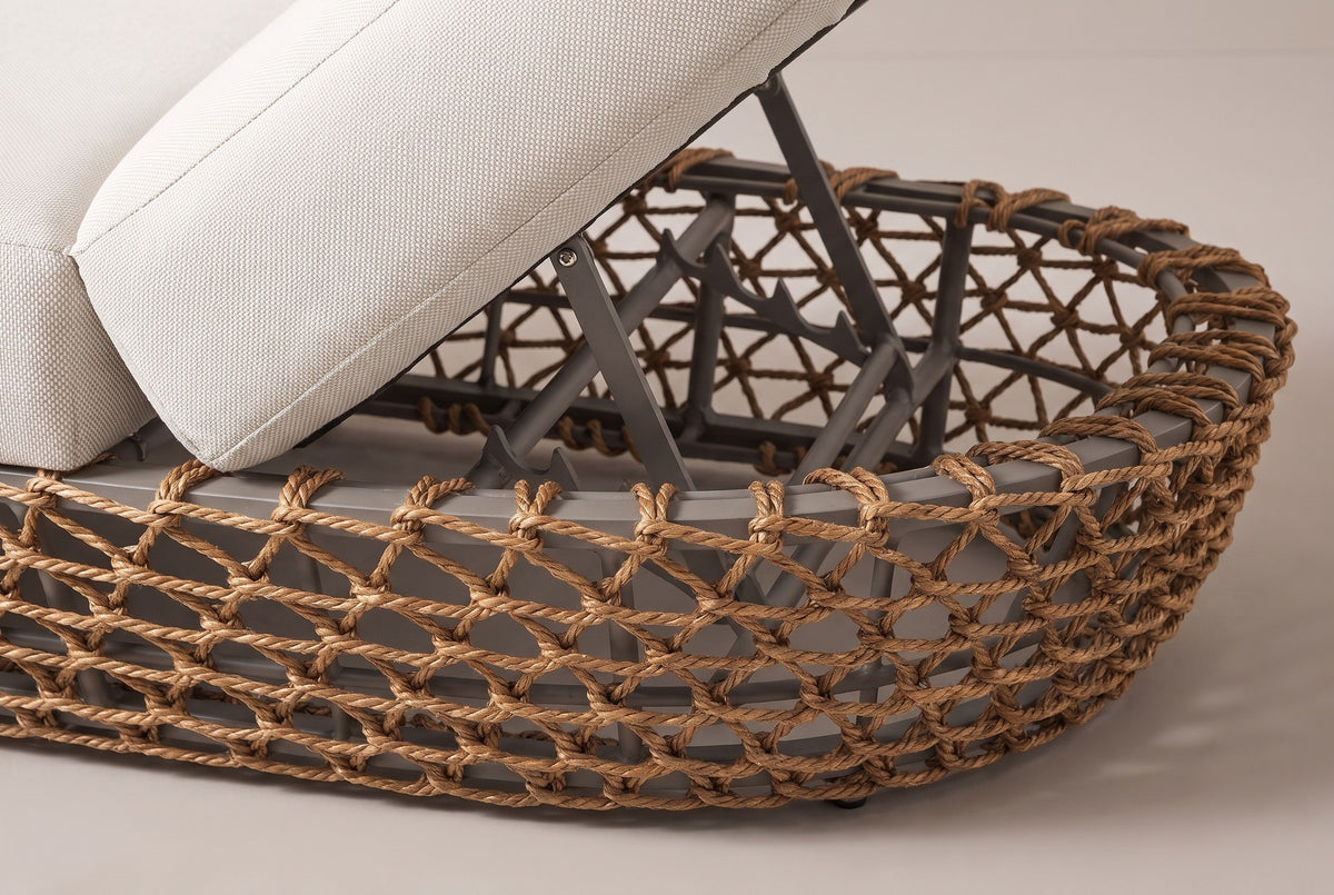 Close-up of the woven base of the Isnello lounger: golden brown twisted cord knotted in an open net over a grey frame