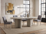 Laino 82-Inch Racetrack Oak Double Pedestal Dining Set with 4 Chairs in an industrial loft dining area