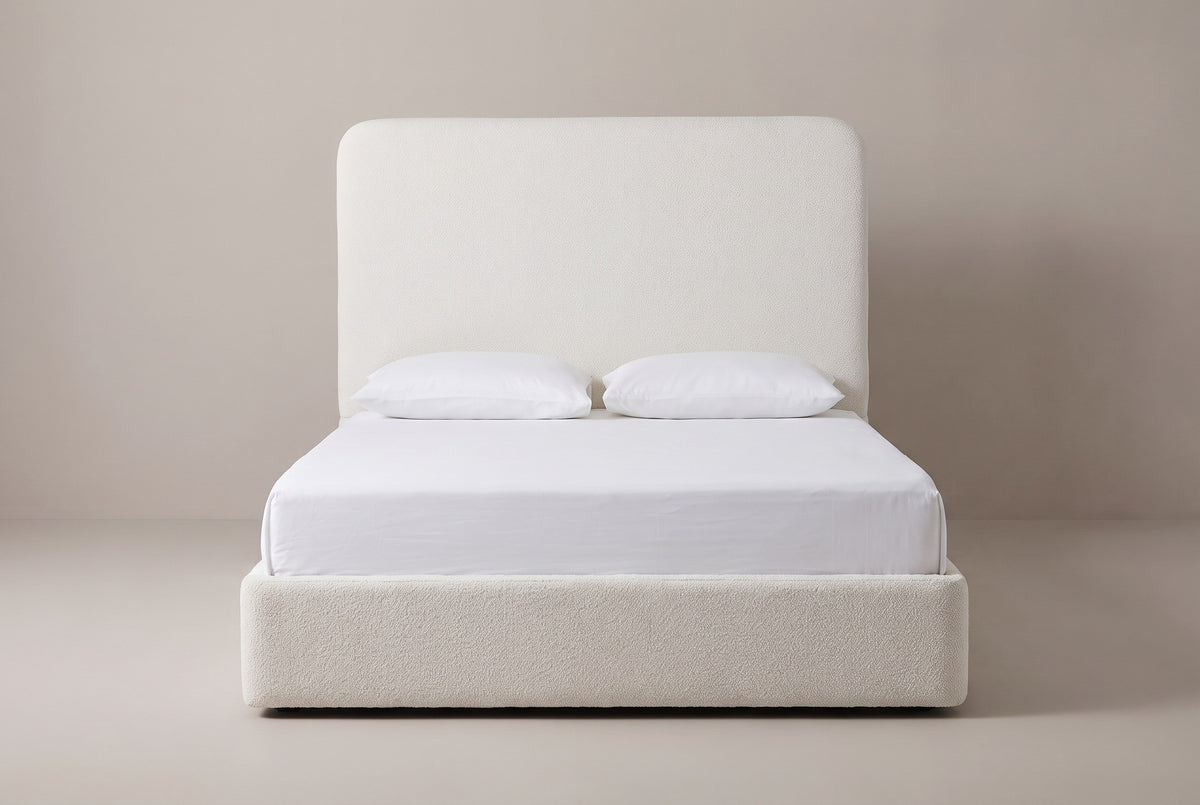 Lanciano bed in pearl white chenille with a white mattress and pillows (not included), front view
