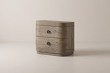 The Lanusei two-drawer nightstand in weathered knotty oak with black ring knobs and rounded front corners, three-quarter view on a light studio backdrop