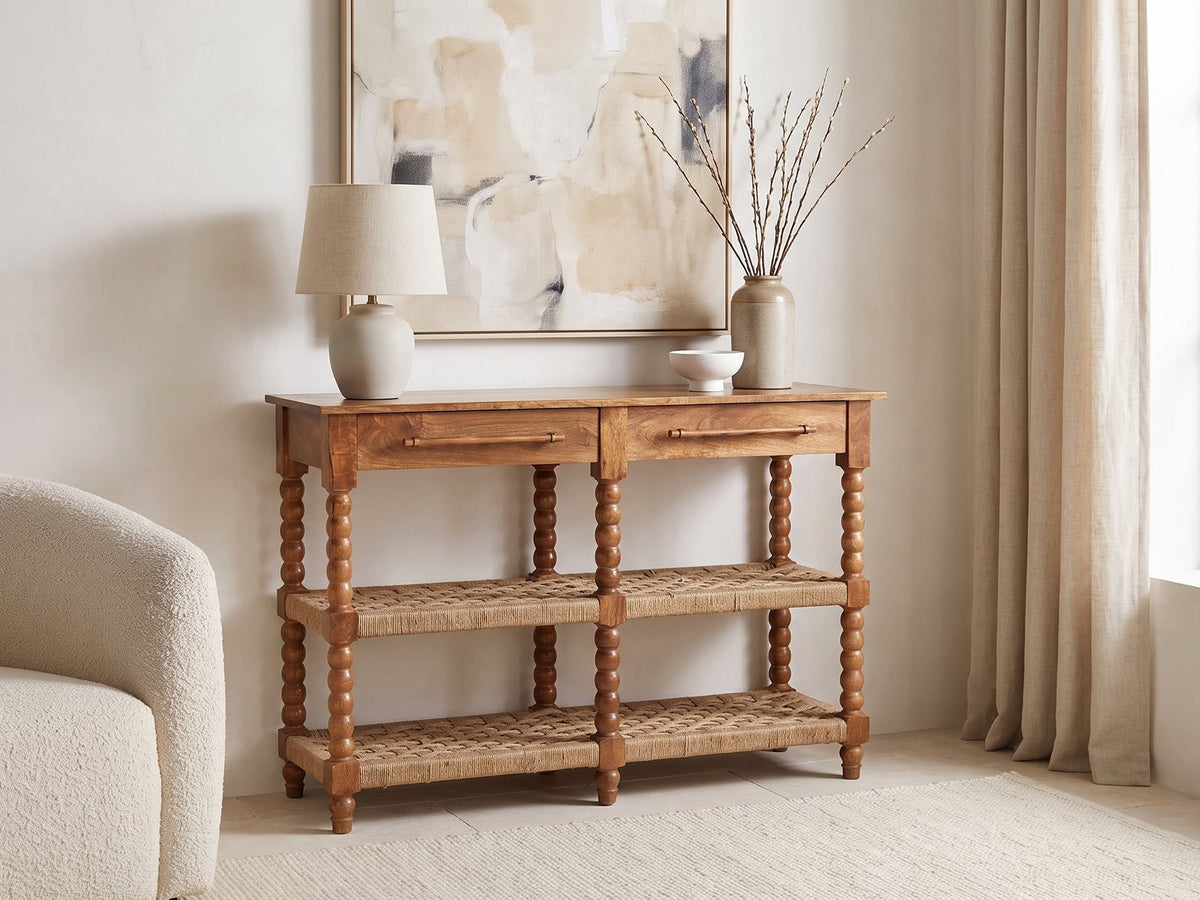 Laterza Mango Wood Spindle Console Table against a plaster wall under an abstract canvas in a bright living room
