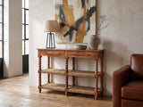 Laterza Mango Wood Spindle Console Table against a plaster wall in an industrial loft
