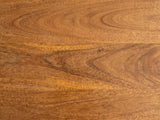 Close-up of the Laterza Mango Wood Spindle Console Table: the chestnut grain of the solid mango top