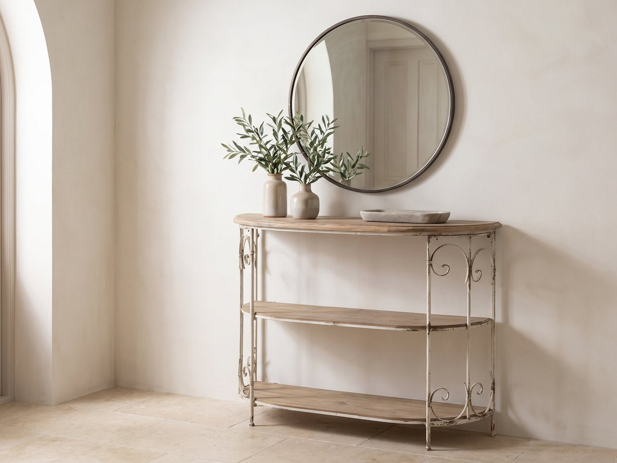 Latiano Fir and Scrolled Iron Three-Tier Console Table under a round mirror in a travertine entryway