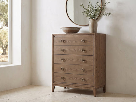 Legnago 40-Inch Latte Elm 5-Drawer Chest under a round bronze mirror in a villa bedroom
