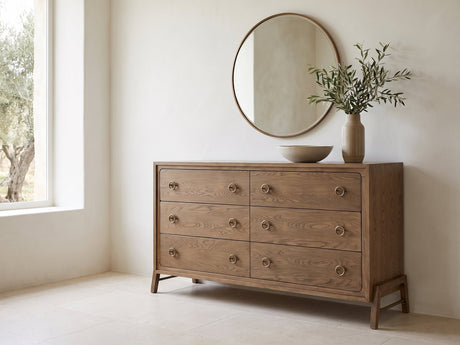 Lendinara 66-Inch Latte Elm 6-Drawer Dresser under a round bronze mirror in a villa bedroom