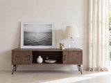 Lerici 60-Inch Reclaimed Wood Hairpin Leg Media Console styled with a leaning print, a lamp and ceramics in a bright plaster room
