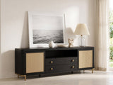 Levanto 80-Inch Black Ash and Rattan Media Console styled with a leaning print, a lamp and ceramics in a bright plaster room