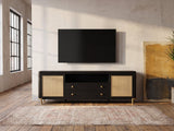 Levanto 80-Inch Black Ash and Rattan Media Console under a wall-mounted screen in an industrial loft