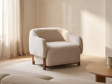 Lido Curved Shell Lounge Chair in a furnished room
