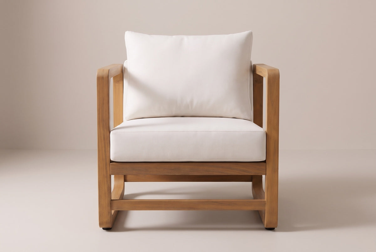 One Linosa lounge chair from the front: the two acacia side loops, a deep white seat cushion and a plump back cushion