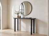 Lizzano Black Mango Wood Bobbin Console Table under a round mirror in a travertine entryway