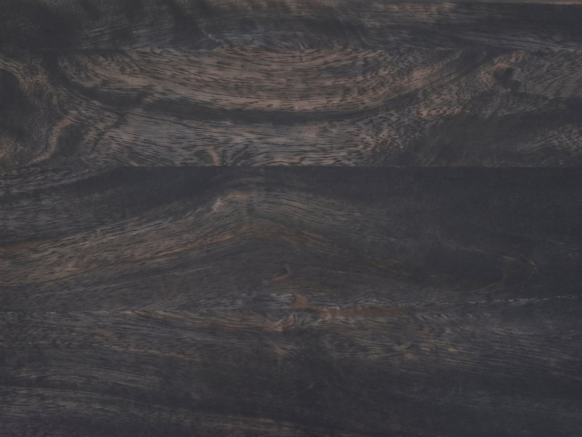 Close-up of the Lizzano Black Mango Wood Bobbin Console Table: the carbon ash finish on the mango top with the grain showing through