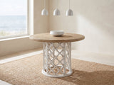 Locri 47-Inch Round Fir Lattice Pedestal Dining Table in a bright coastal dining room on a jute rug