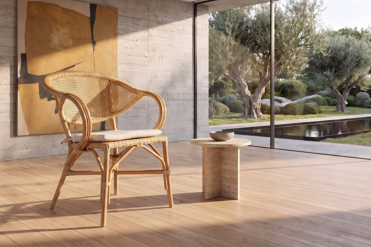Longobardi Oval-Back Natural Rattan Dining Chair in a sunlit villa dining room