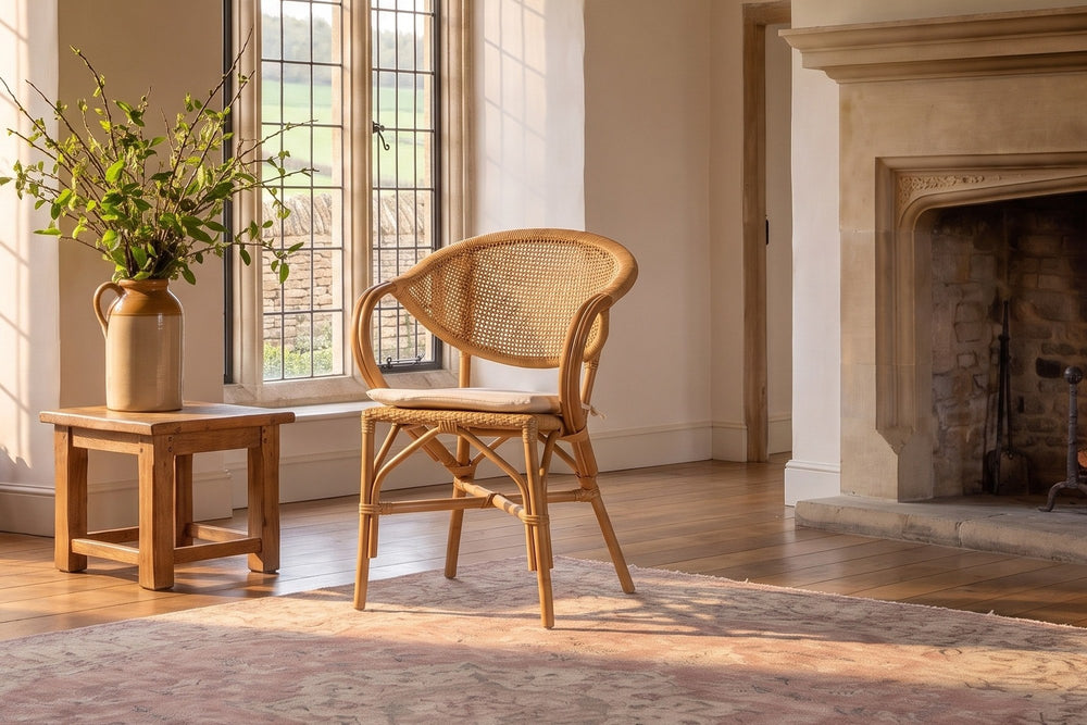 Longobardi Oval-Back Natural Rattan Dining Chair in an English country dining room