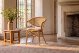 Longobardi Oval-Back Natural Rattan Dining Chair in an English country dining room