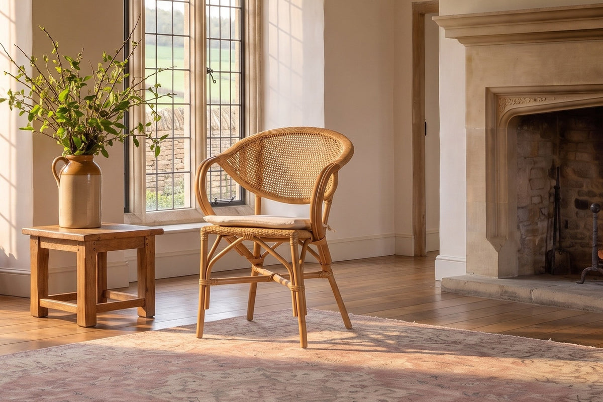 Longobardi Oval-Back Natural Rattan Dining Chair in an English country dining room