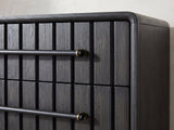 Close-up of the Lonigo 38-Inch Peppercorn 3-Drawer Chest: the black bar pull and its brass bracket over the ribbed drawer front