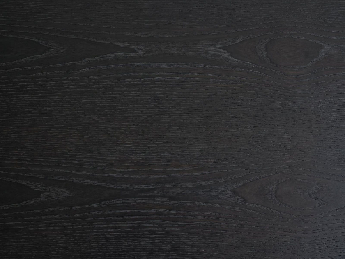 Close-up of the Lonigo 38-Inch Peppercorn 3-Drawer Chest: the wire-brushed elm grain of the top under the peppercorn finish