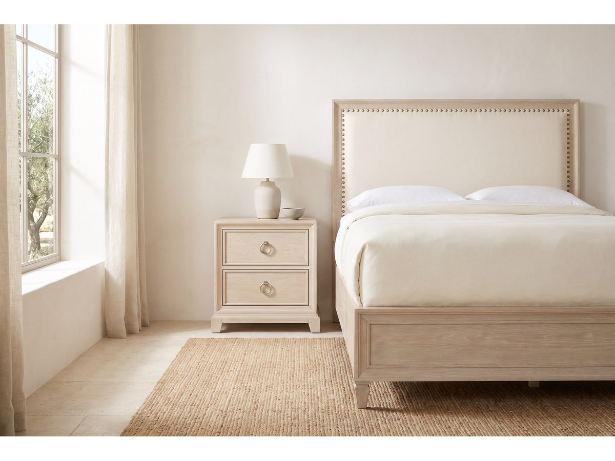 Loreto Washed Oak Upholstered Bedroom Set: nightstand beside the bed