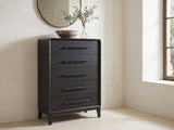 Lusiana 35-Inch Peppercorn Black 5-Drawer Chest under a round bronze mirror in a villa bedroom