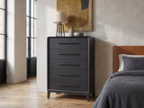 Lusiana 35-Inch Peppercorn Black 5-Drawer Chest against a plaster wall in an industrial loft bedroom