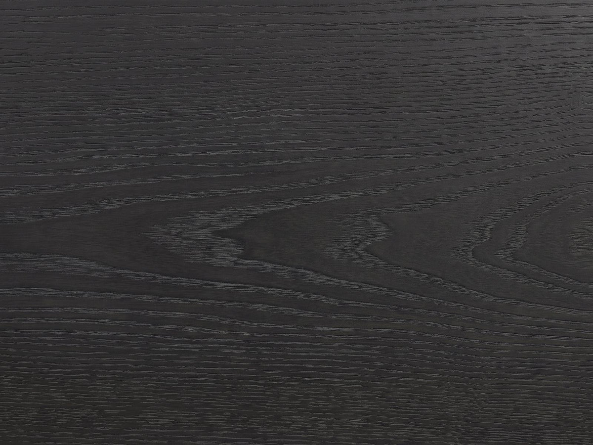 Close-up of the Lusiana 35-Inch Peppercorn Black 5-Drawer Chest: the flat-cut black peppercorn elm veneer grain