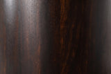Close-up of the dark mocha mango wood on the Macomer nightstand: deep coffee brown grain with reddish and copper streaks